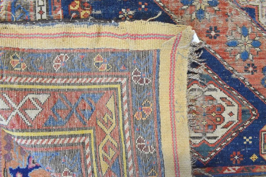 A blue ground Caucasion kazak design rug (heavily worn) - Image 2 of 7