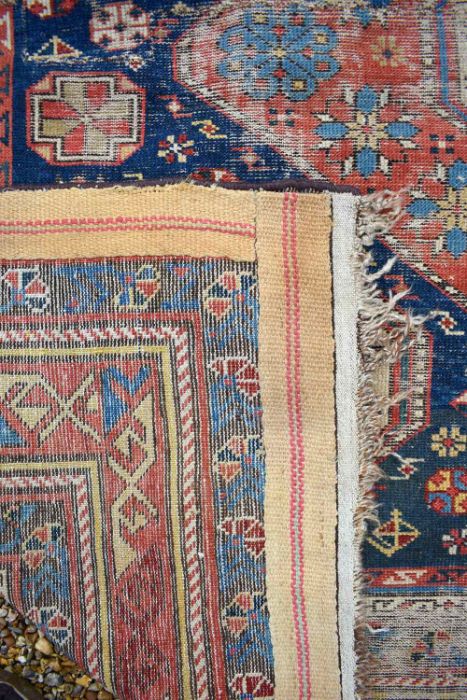 A blue ground Caucasion kazak design rug (heavily worn) - Image 7 of 7