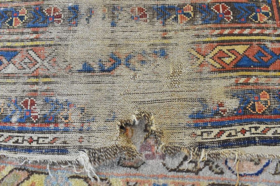 A blue ground Caucasion kazak design rug (heavily worn) - Image 4 of 7