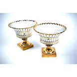 A pair of Continental porcelain stemmed baskets