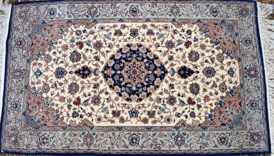 A classic Nian rug, traditional cream ground with floral design