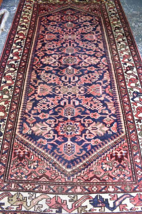 A Malayer carpet, the stylised floral design on dark blue ground - Image 2 of 3