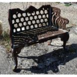 An old weathered cast iron garden bench