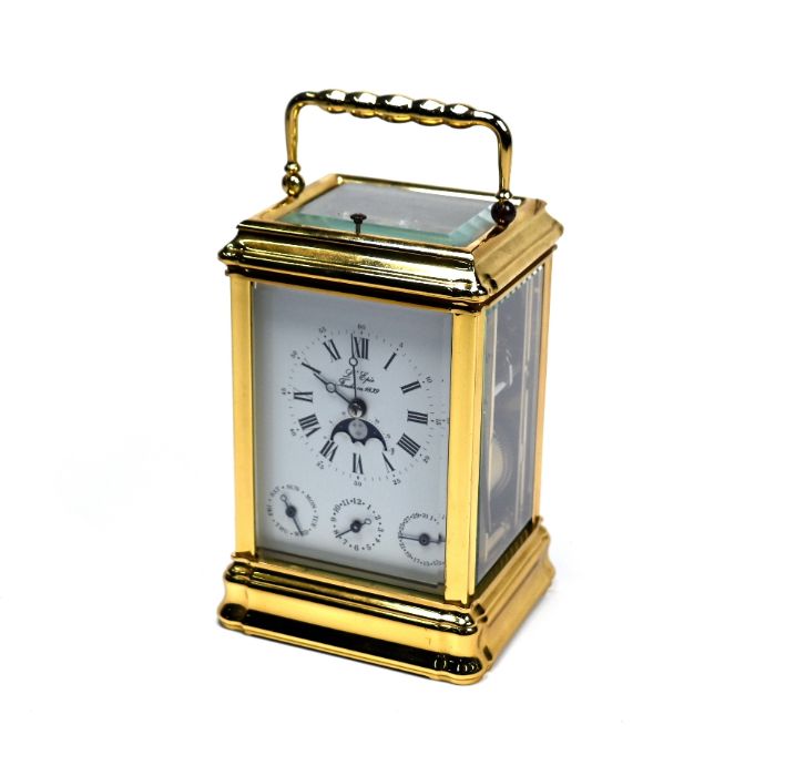L'Epee, a contemporary French lacquered brass calendar carriage clock