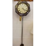 An antique rosewood octagonal wall clock