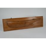 A Victorian carved wood half-hull model of a clinker-built yacht
