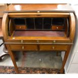 A 19th century mahogany inlaid cylinder top desk