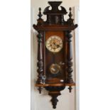 A walnut cased Vienna style wall clock