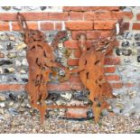 A steel garden feature silhouette of two boxing hares