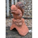 A reconstituted aged terracotta squirrel ridge tile