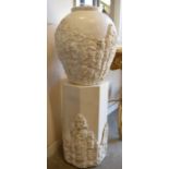 A simulated-limestone vase and plinth