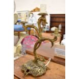 A Rococo style three-branch gilt metal lamp