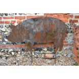 A black painted steel garden feature silhouette of a large standing pig