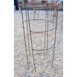 A pair of weathered steel curved garden plant frames
