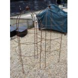 Pair weathered steel dumpy ball head obelisks