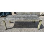 A large weathered teak garden dining table by 'Chic Teak'