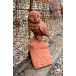 A reconstituted aged terracotta owl ridge tile