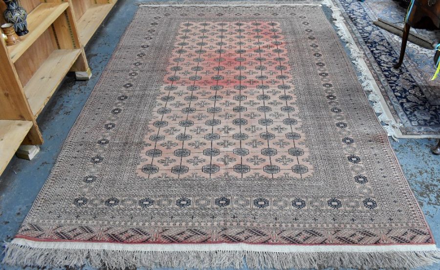 A red ground washed Afghan carpet