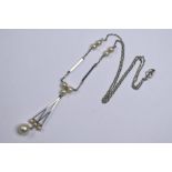 An early 20th century white metal necklace set with cultured pearls