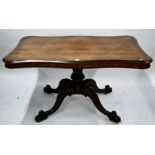 A Victorian rosewood serpentine top centre table