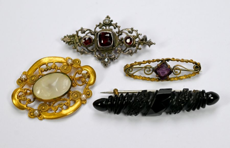 Four various brooches