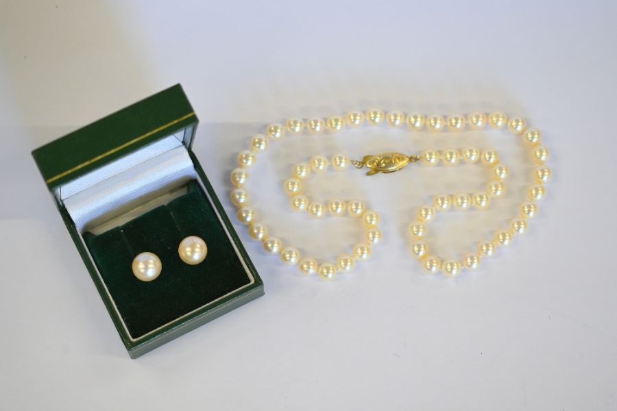 Cultured pearl necklace and pair of pearl earrings