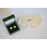 Cultured pearl necklace and pair of pearl earrings