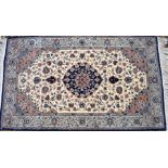 A classic Nian rug, traditional cream ground with floral design