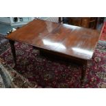 A Victorian mahogany extending dining table