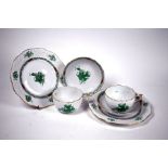 A Herend Apponyi Green double-trio of tea-cup, saucer and plate