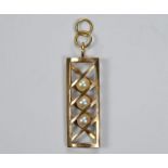 A 9ct yellow gold cagework pendant