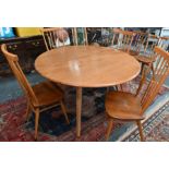 A vintage Ercol drop leaf table and chairs (5)