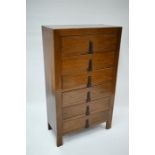 An antique Tibetan elm scroll chest of six drawers