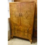 A vintage walnut cabinet
