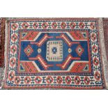 A Turkish red and blue ground rug