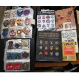 A large collection of US Army patches and badges