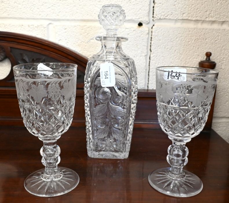 A hobnail cut glass decanter pair of vine-etched goblets