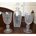 A hobnail cut glass decanter pair of vine-etched goblets