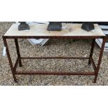 Metal garden table with a marble top