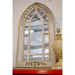 A Gothic arch shaped wall mirror and a mosaic wall mirror