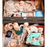 A quantity of reproduction bisque dolls, parts, costume