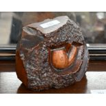 A rootwood block paperweight carved with a smoker's pipe-bowl