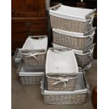 Nine rectangular grey wicker baskets