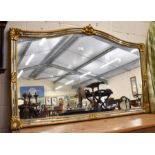 A large 1970s Holywood Regency arched mirror