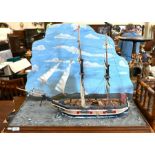 A primitive school painted wood model of a two-masted ship