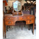 A mahogany bowfront dressing table and 'shield' toilet mirror