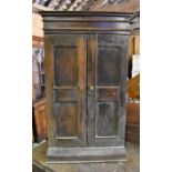 A small antique oak side cabinet