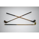 Three children's vintage golf clubs with hickory shafts