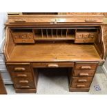 An antique oak roll top desk and chair - a/f