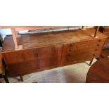 A mid century teak sideboard